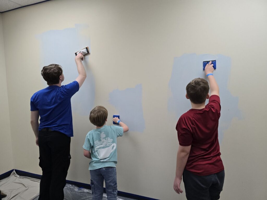 Students paint the calm down room at Murphy Middle School in Murphy, TX.