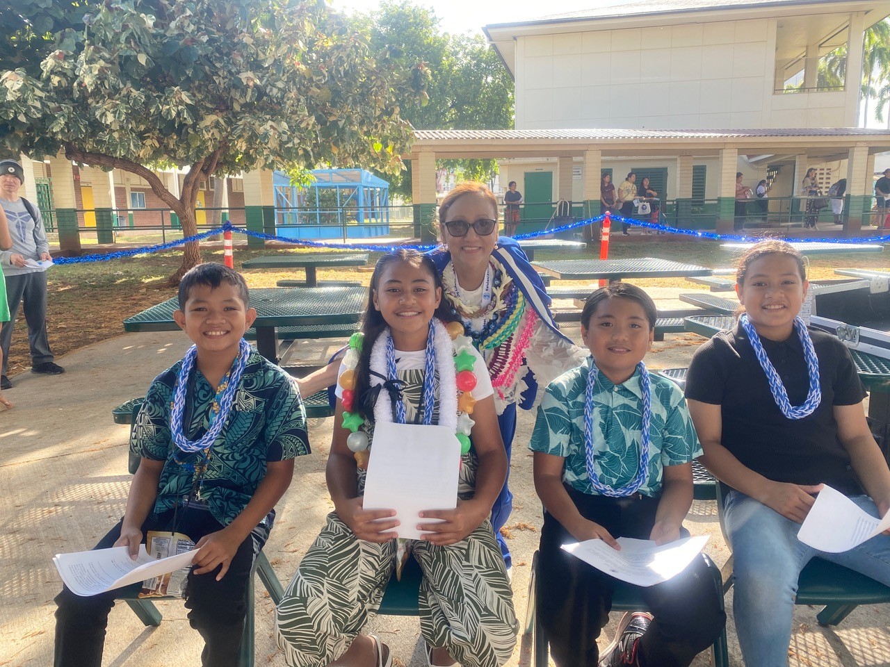Bebi Davis, principal of Ka’iulani Elementary School in Honolulu, HI, with students at graduation last year. Photo courtesy of Bebi Davis.
